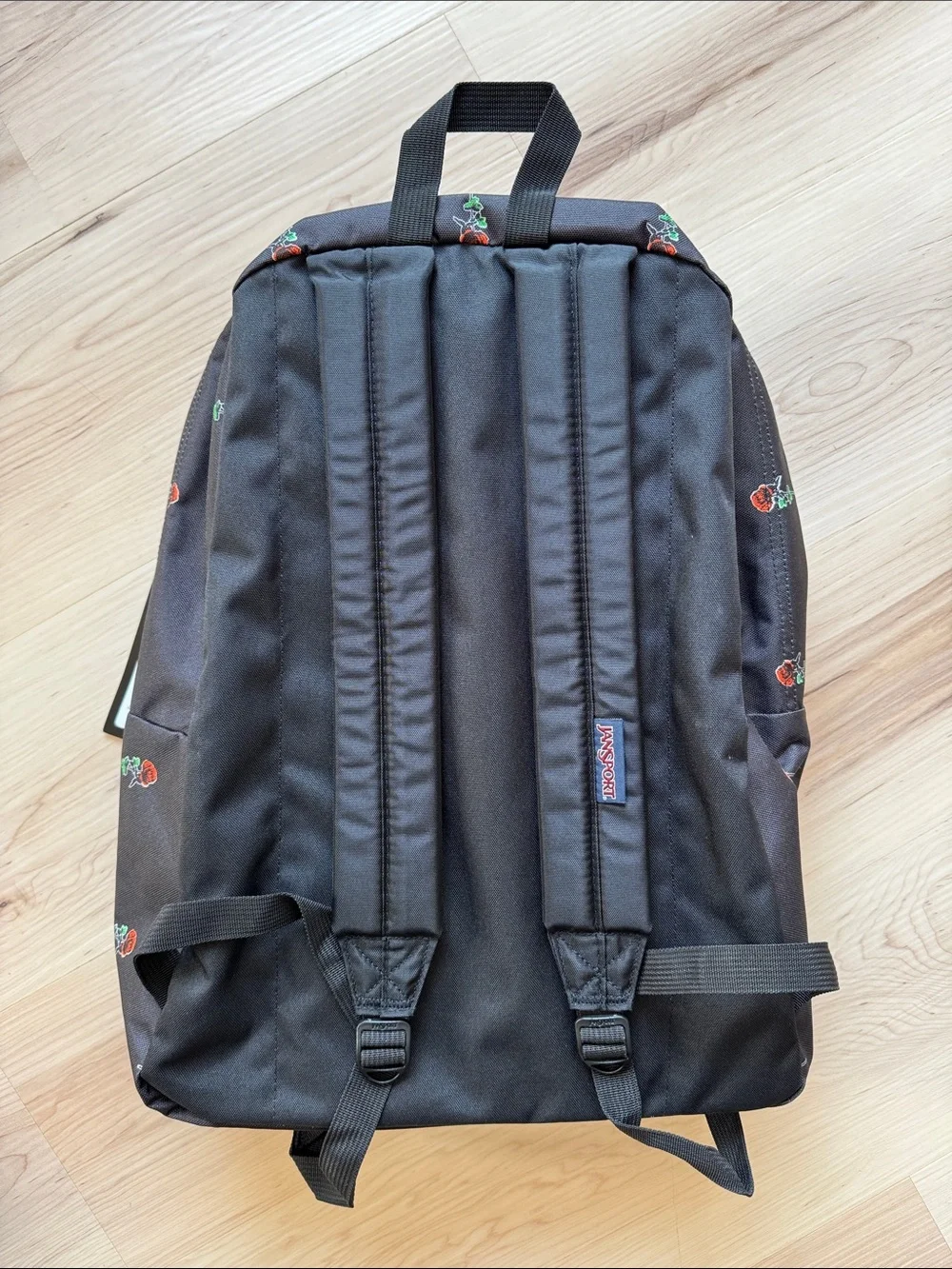 Jansport Black Backpack with Red Rose Print